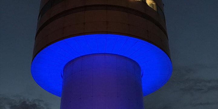 Apron tower lit up blue