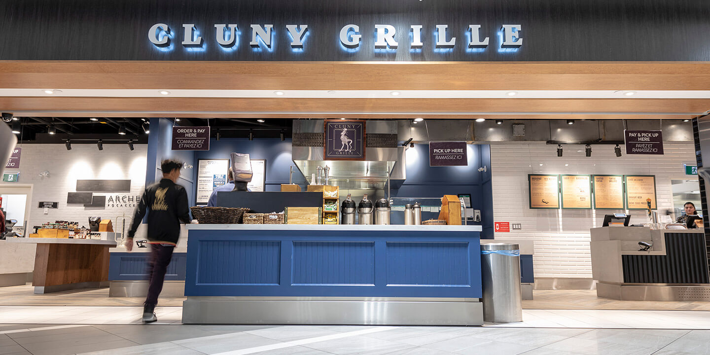 Cluny Grille sign above ordering counter and coffee station 