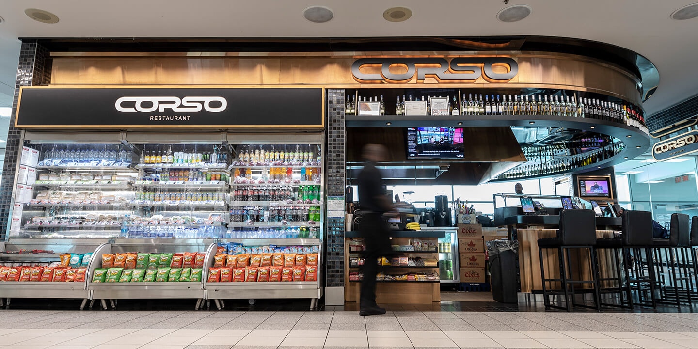 Corso grab-and-go fridge with drinks and snacks, next to bar with seating 