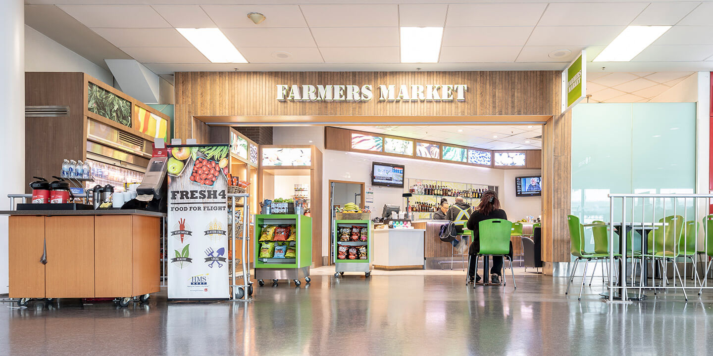 view of farmers market sign and open concept counters