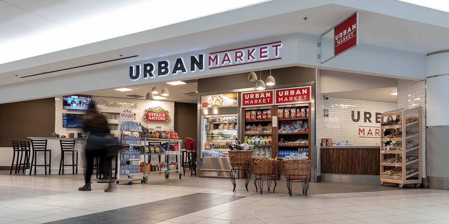 Urban Market grab-and-go snack and drink displays and bar seating with chairs