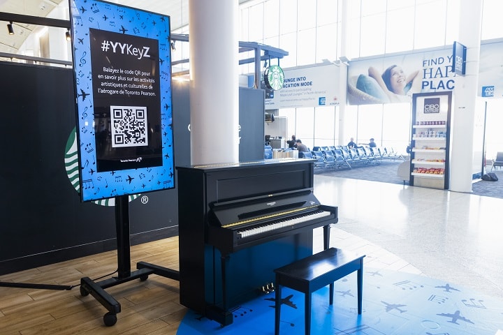 Woman playing  the piano in the Terminal