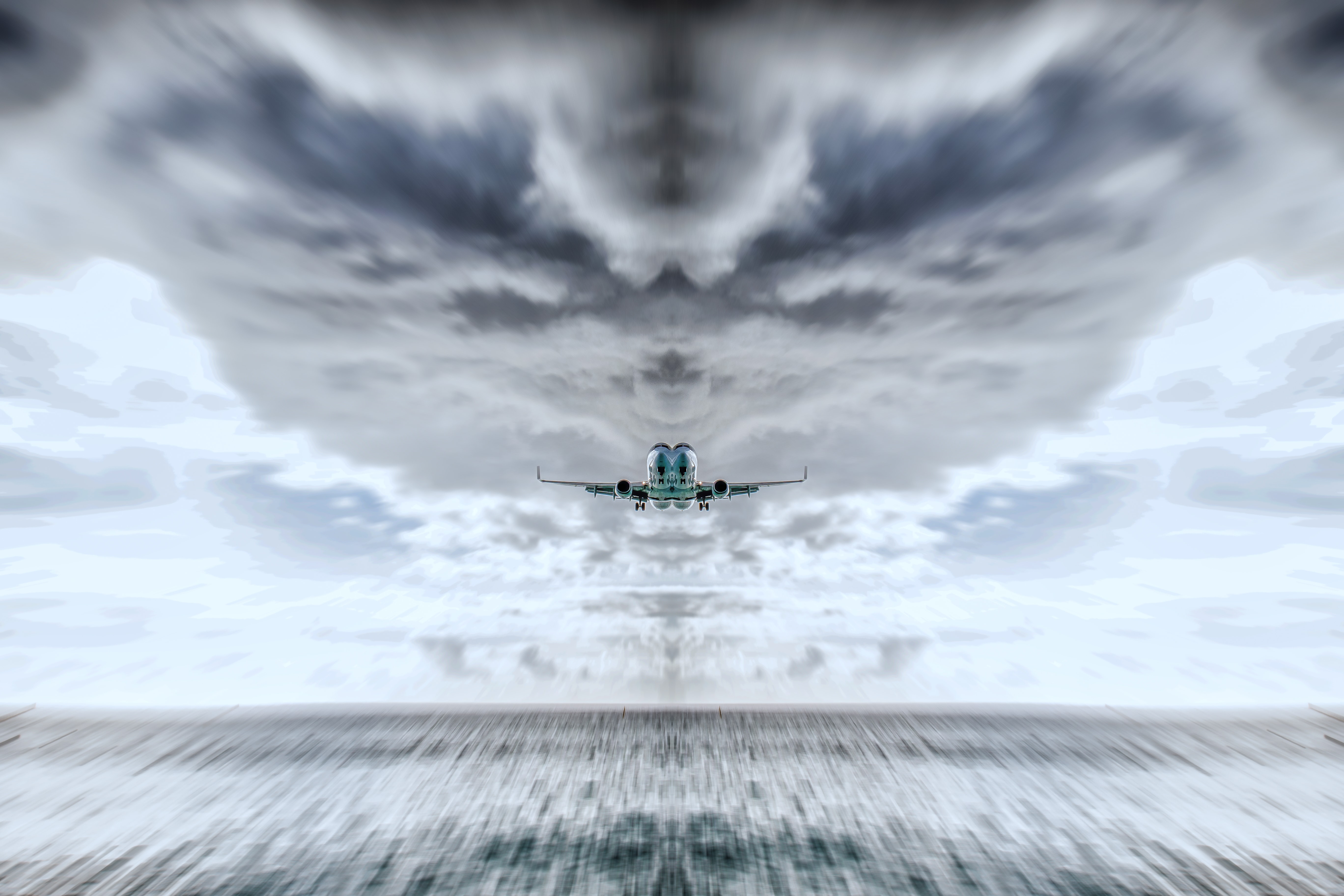 Plane landing against stormy skies